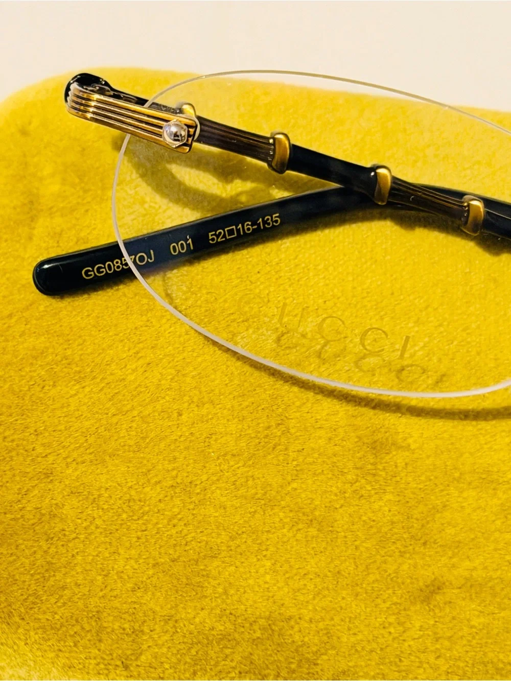 Gucci Rimless Men's Glasses in Black and Gold Accents